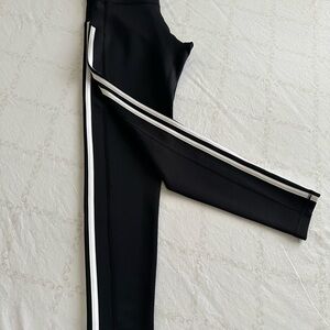 Adidas’s Black Women's Athletic Pants with Iconic White Stripes